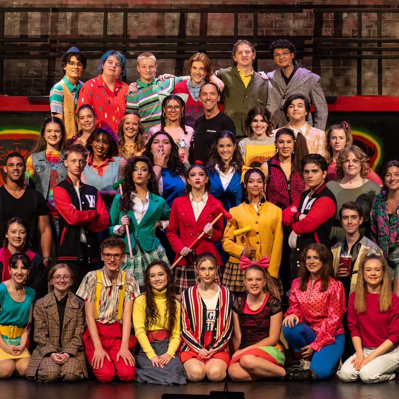 Group photos of summer camp for teens in costume on stage