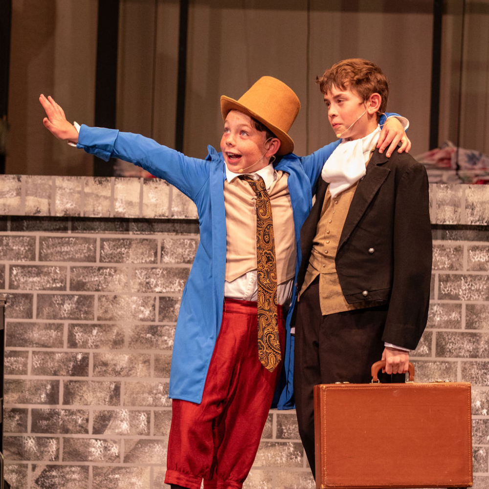 two students on stage