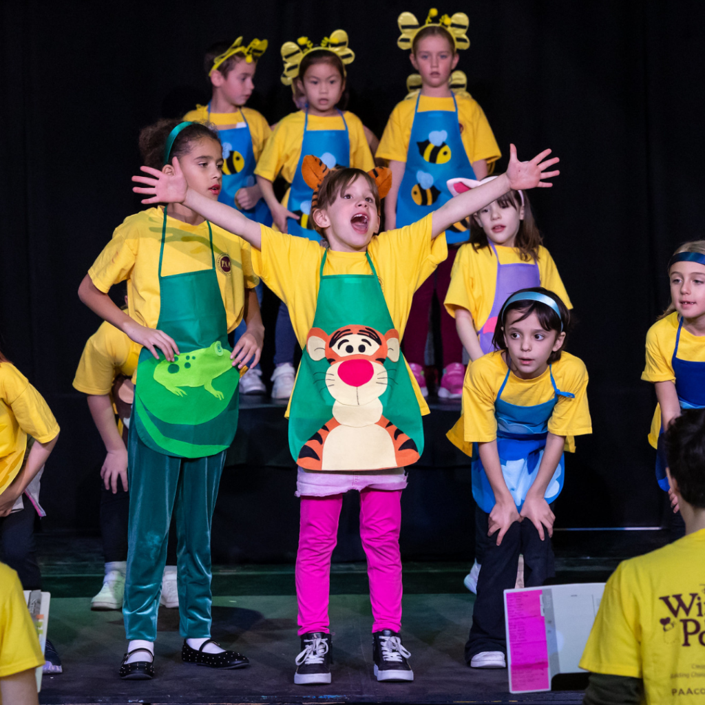 kids singing on stage