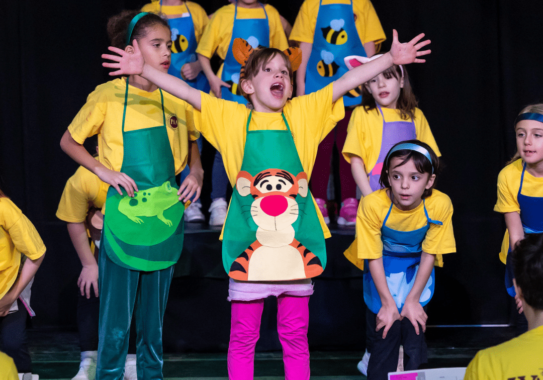 kids singing on stage