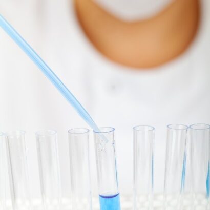scientist-fills-test-tubes