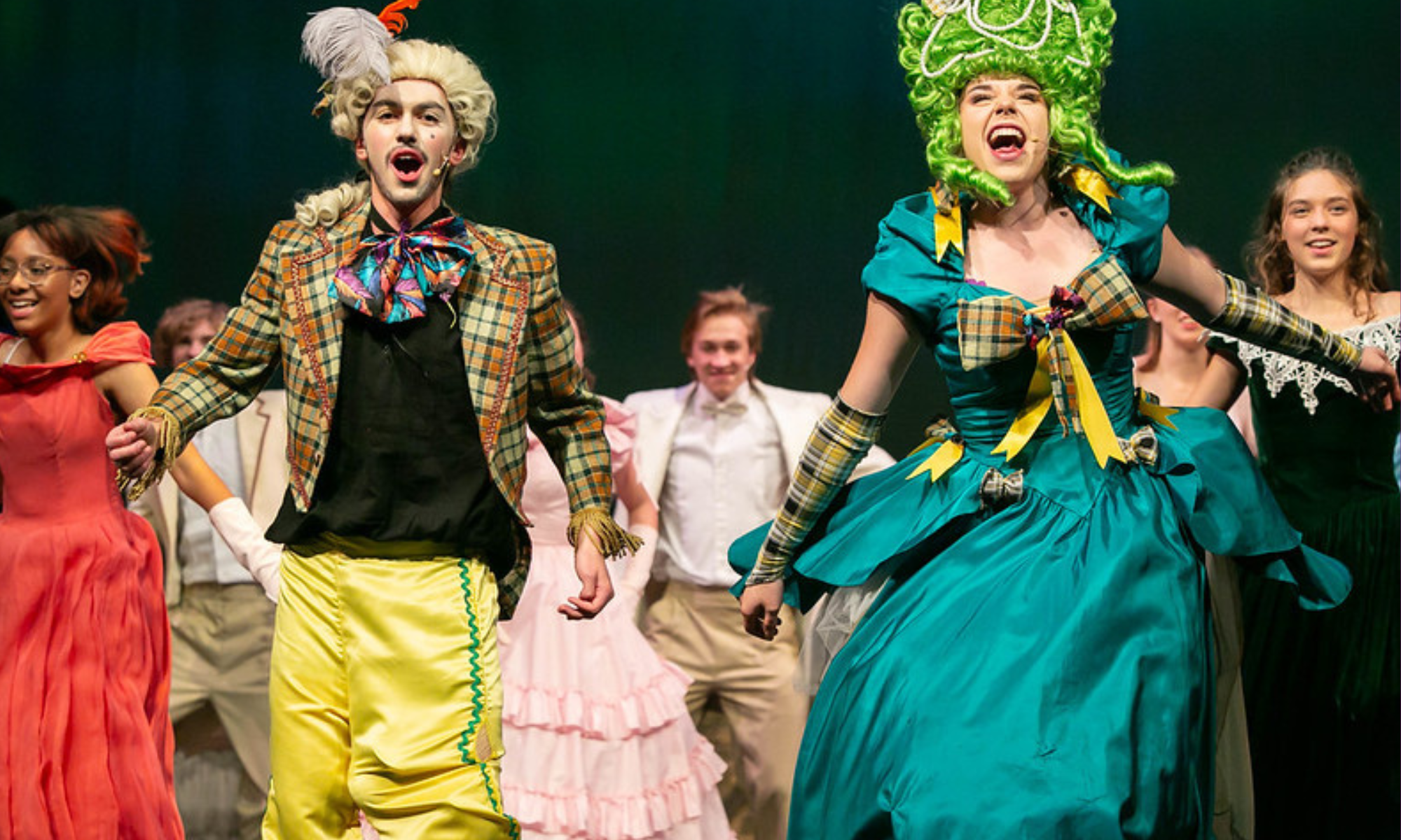 two cast members on stage