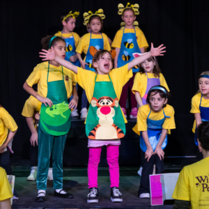 kids singing on stage